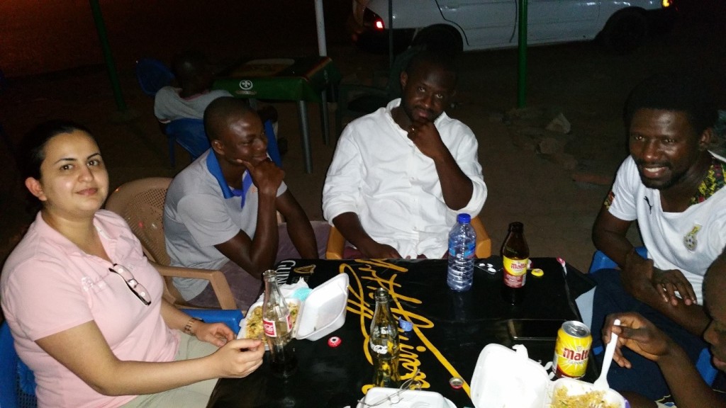 Enjoying indomie after a day of hard work in the field